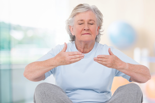 old woman meditating old woman meditating