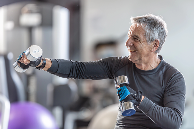 older man working out dumbbells
