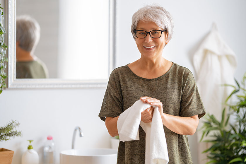 Person washing hands using towel protection coronavirus prevention hygiene stop