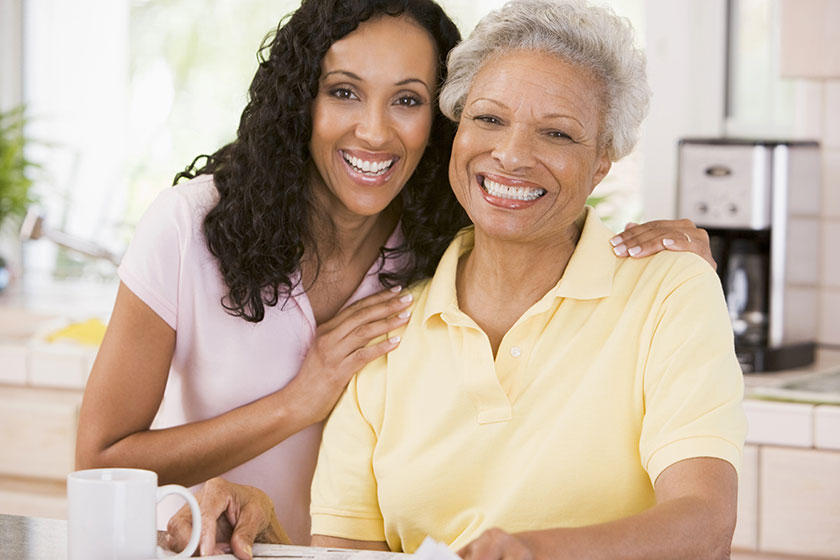 Portrait of pretty senior woman exercising with dumbbells