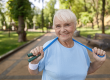pretty senior lady with jump rope poses