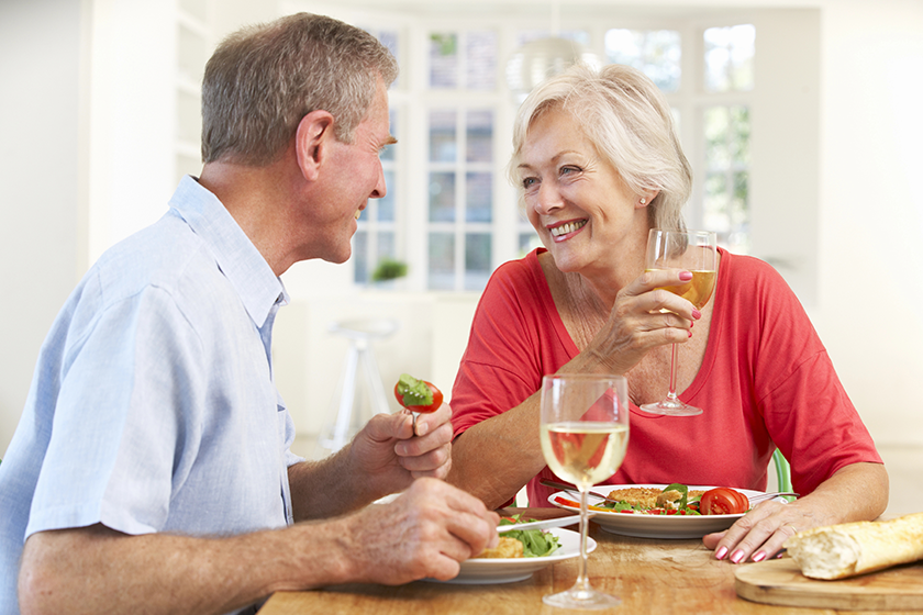 retired couple enjoying meal