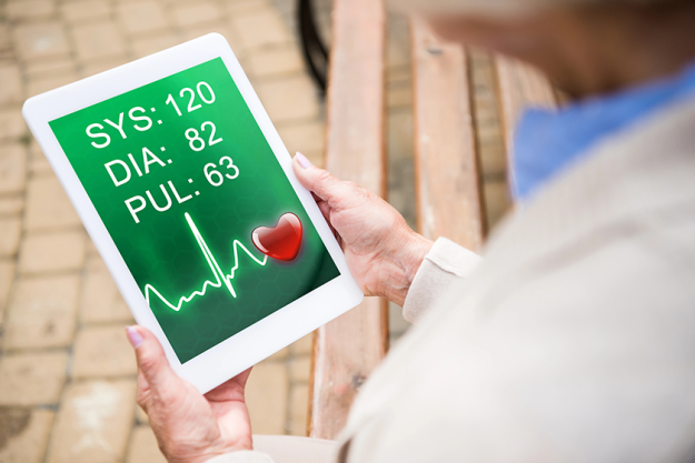 selective focus senior woman using digital table