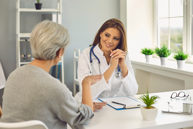 senior lady on visit to doctor at hospital