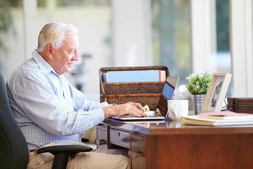 senior man using laptop