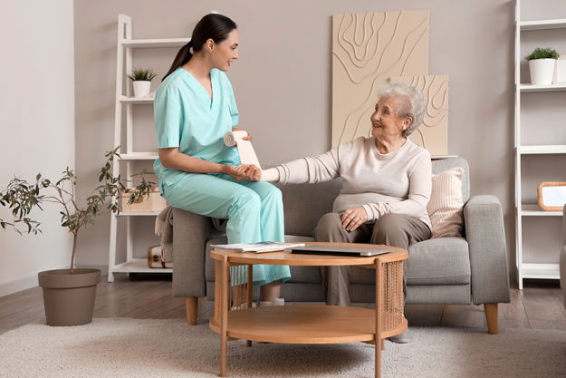 senior woman physical therapist bandaging