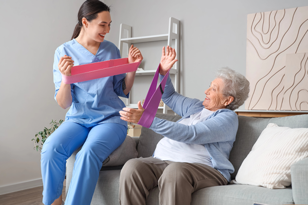 senior woman physical therapist stretching bands