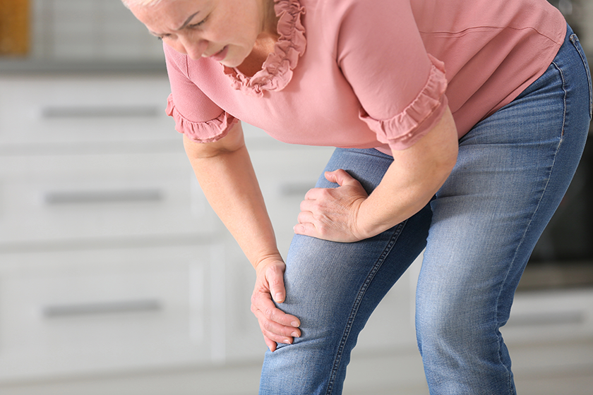 senior woman suffering from knee pain senior woman suffering from knee pain