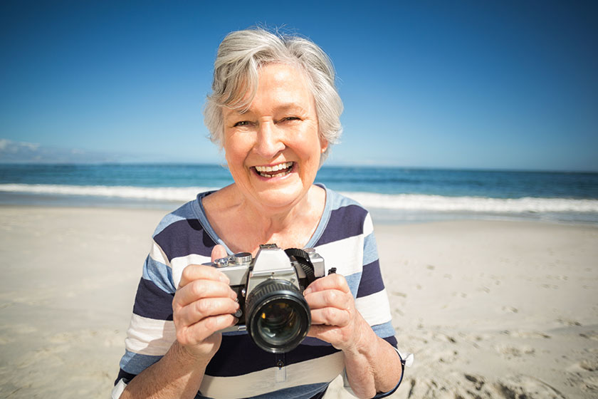 Senior woman taking picture