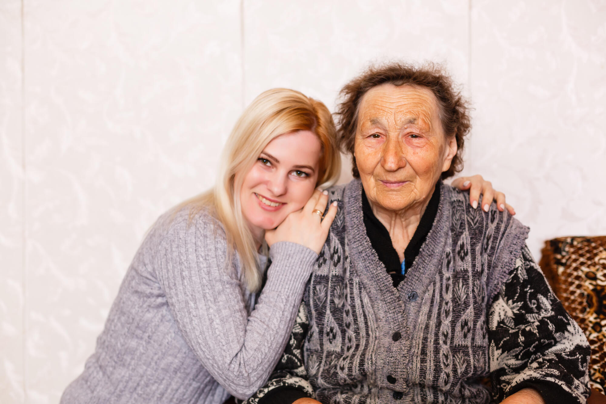 Grandmother and granddaughter portrait, embraced