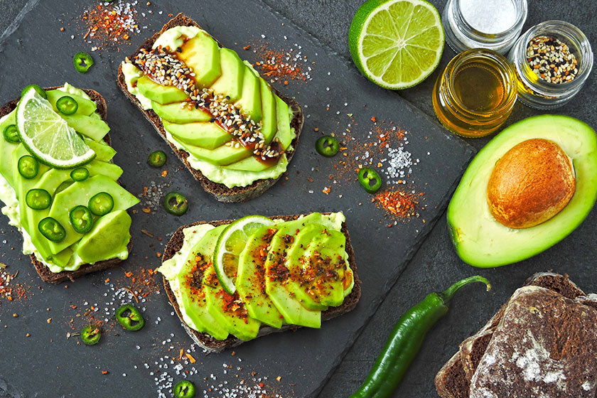 Beautifully plated avocado toast delicious looking toppings avocado toasts presented