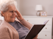 senior woman notebook home age related memory impairment