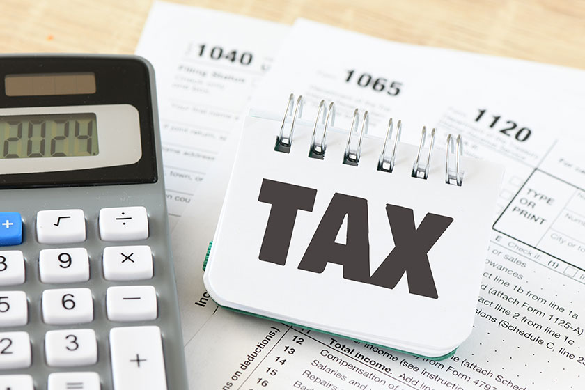 Tax word small office notebook new year tax concept income Tax word small office notebook new year tax concept income