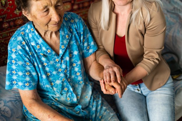 Senior woman with her home caregiver