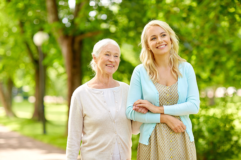 daughter with senior mother at park