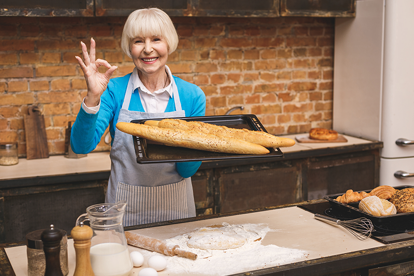 portrait attractive smiling happy senior aged woman cooking portrait attractive smiling happy senior aged woman cooking