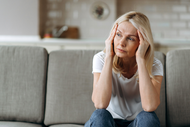sad caucasian senior woman wearing casual clothes