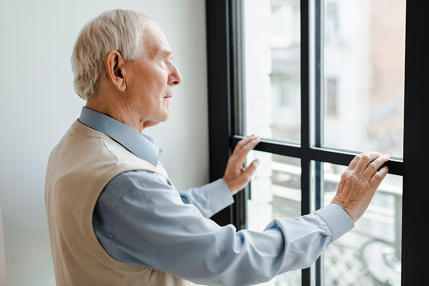 sad elderly man looking window sad elderly man looking window
