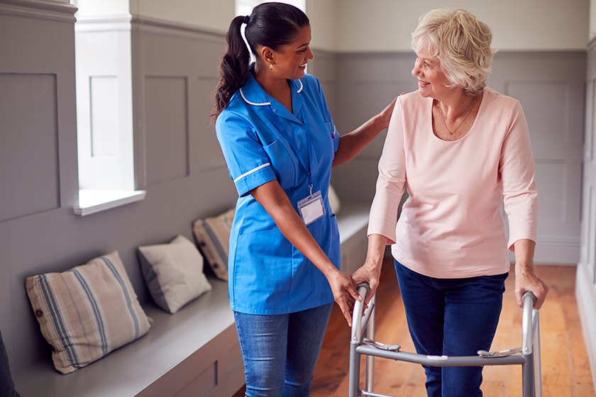 senior woman home using walking frame