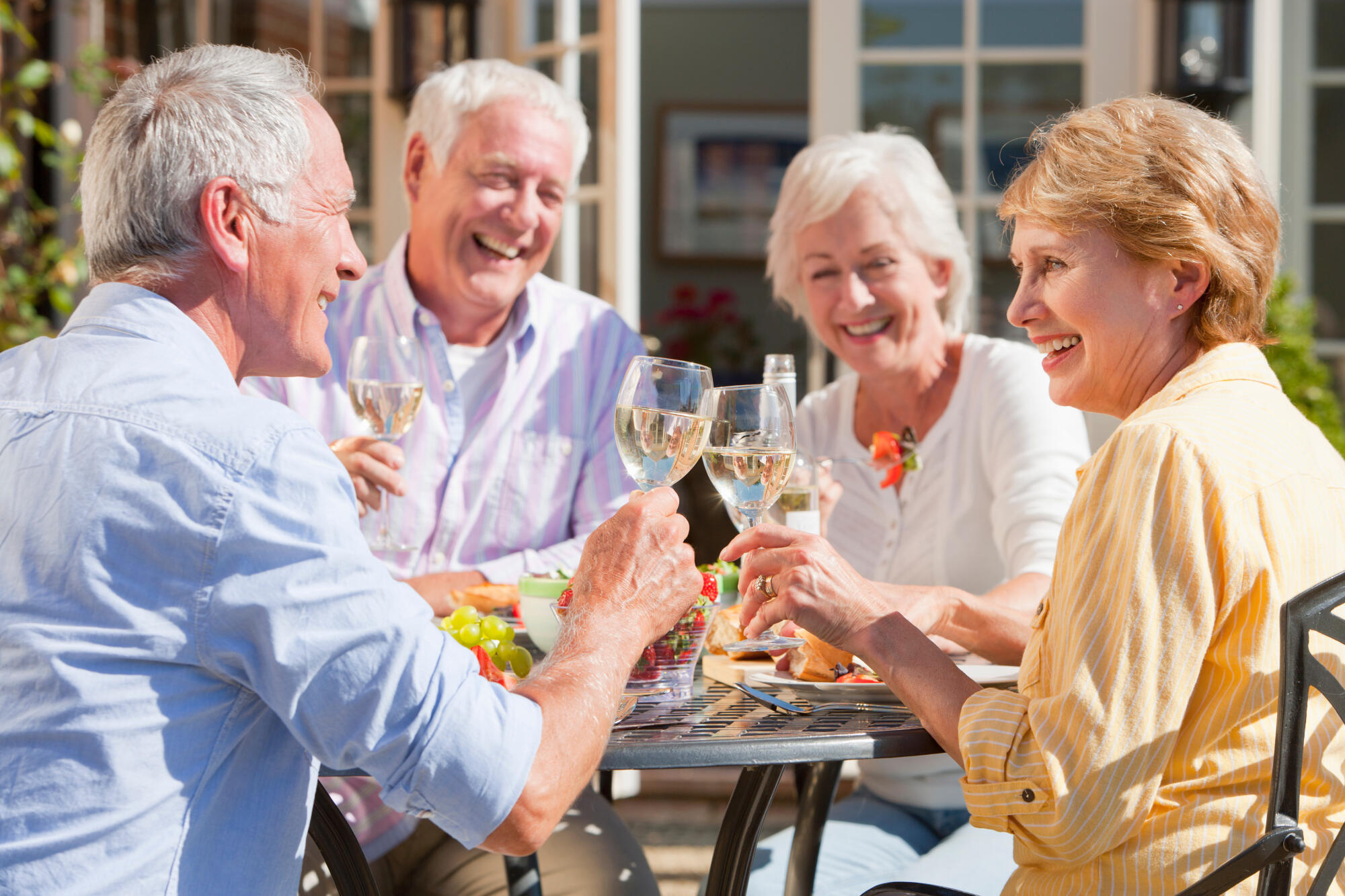 Medium,Shot,Of,An,Elderly,Couple,Having,Lunch,And,Toasting