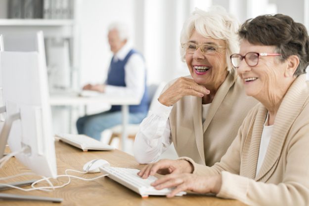 Two,Elder,Women,With,Glasses,Learning,How,To,Use,Computer