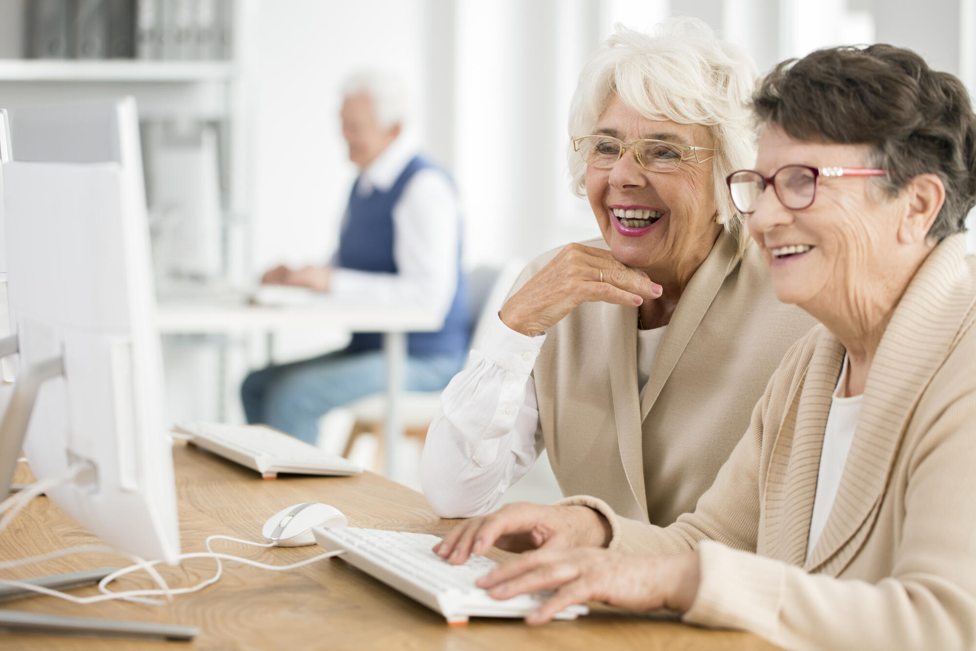Two,Elder,Women,With,Glasses,Learning,How,To,Use,Computer