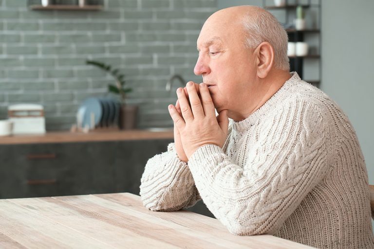 Portrait elderly man home