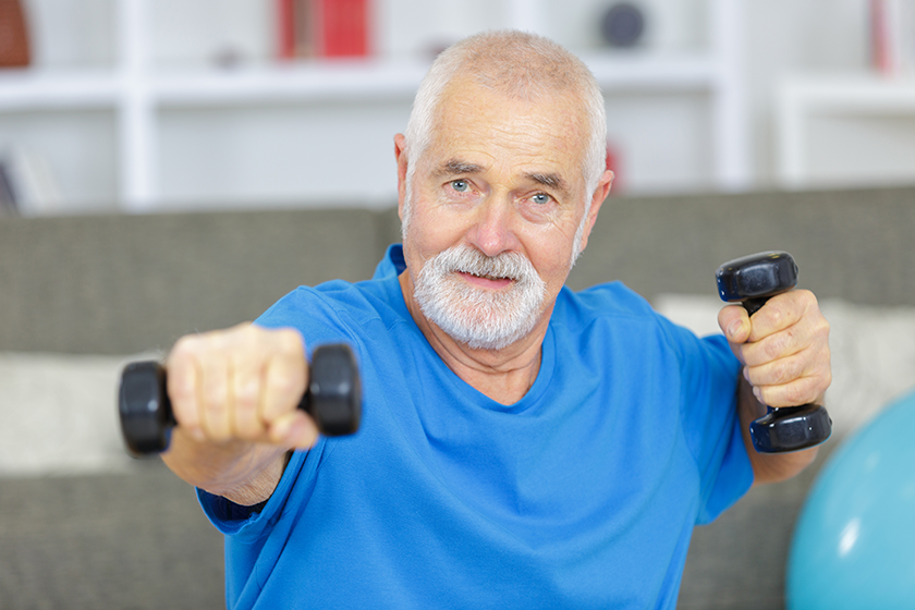 senior man lifting dumbbells