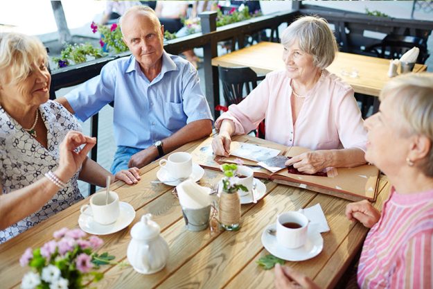 Senior people gathered for tea and talk