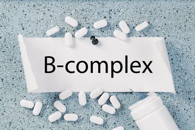 Vitamin complex text white capsules pills Vitamin complex text white capsules pills