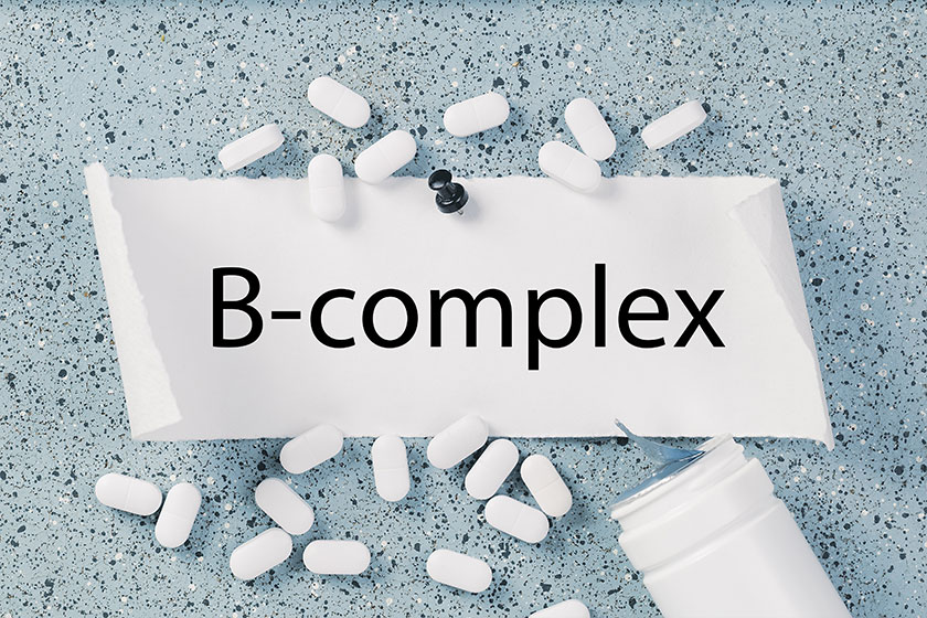 Vitamin complex text white capsules pills