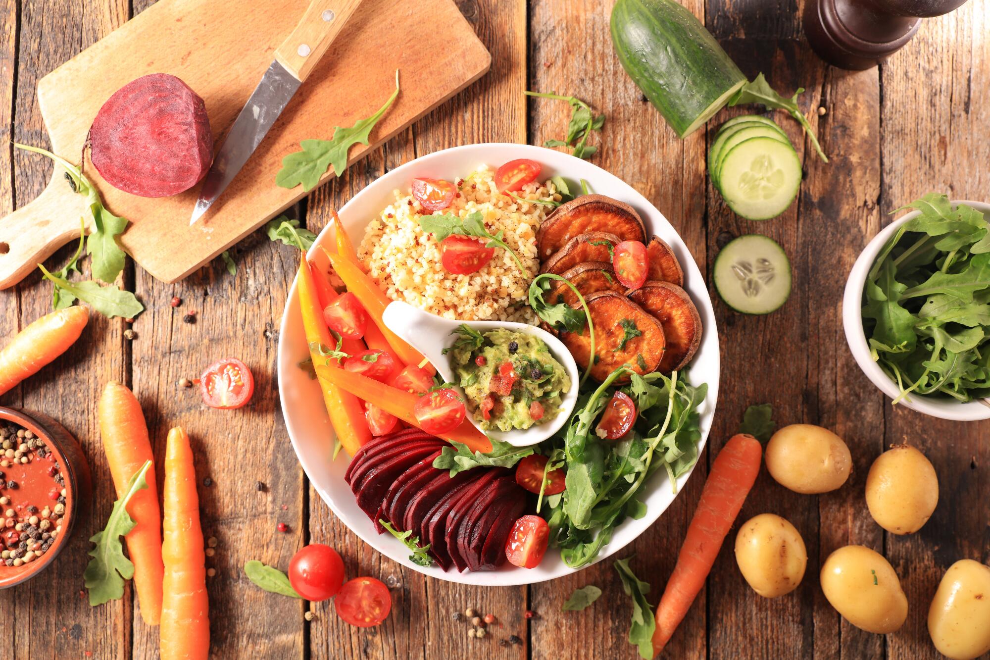 Vegan,Meal,Bowl,With,Sweet,Potato,,Beetroot,,Guacamole,And,Semolina