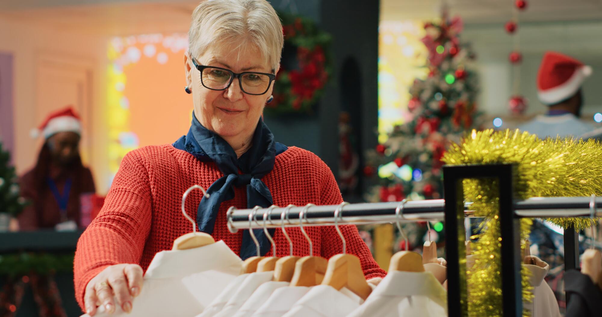 Woman looking at clothes on rack