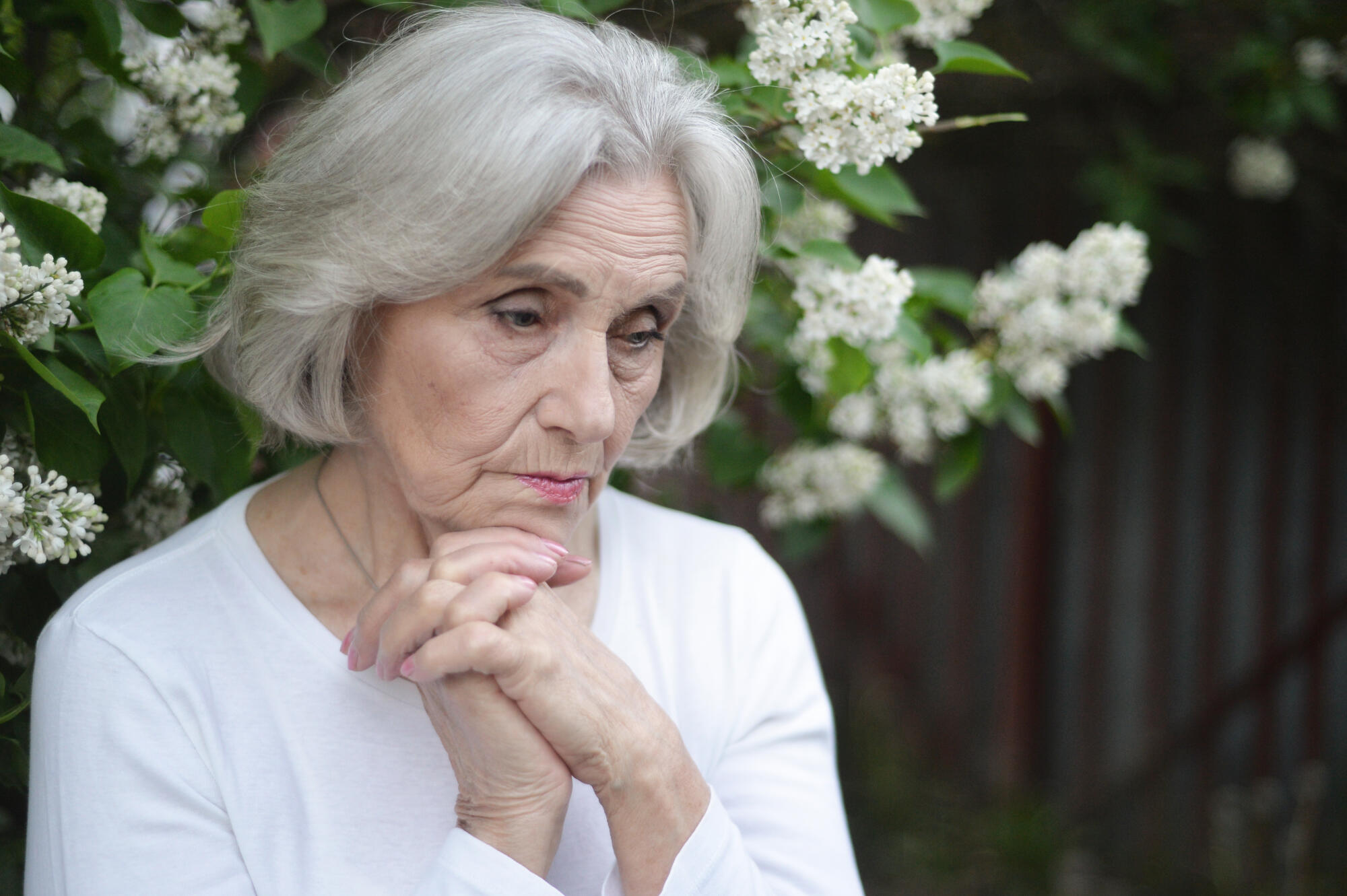 Portrait of senior sad woman in park Portrait of senior sad woman in park