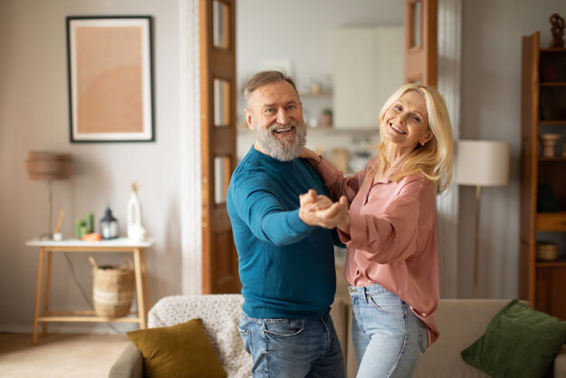 Cheerful mature spouses dancing enjoying senior life having fun modern Cheerful mature spouses dancing enjoying senior life having fun modern