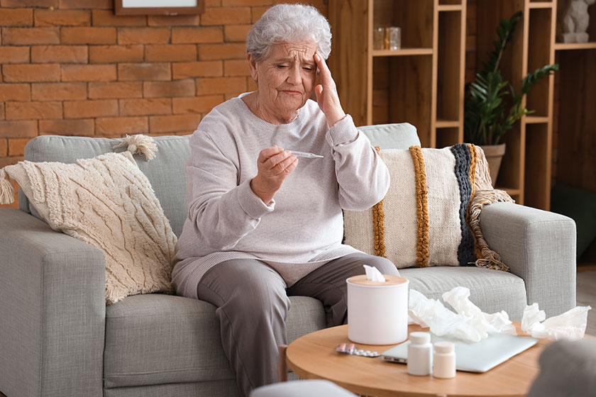 Ill senior woman thermometer home Ill senior woman thermometer home