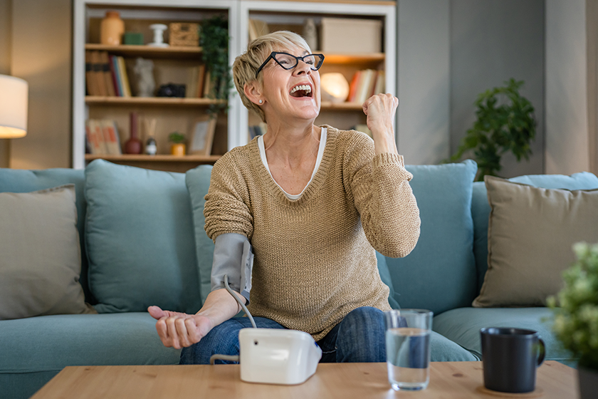 one woman senior caucasian female use blood pressure device