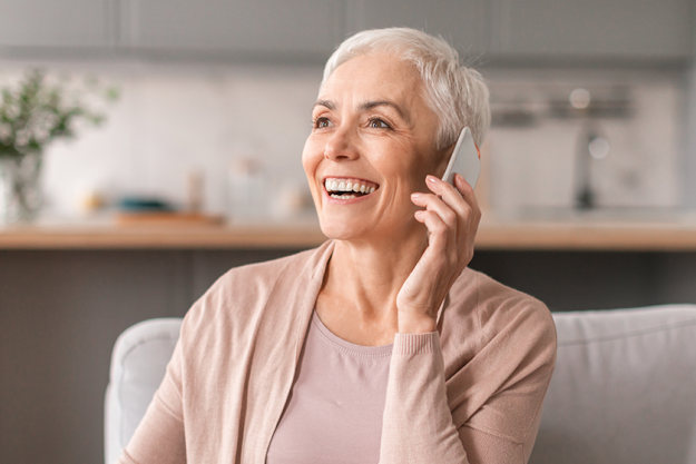 smiling mature woman talking cellphone smiling mature woman talking cellphone