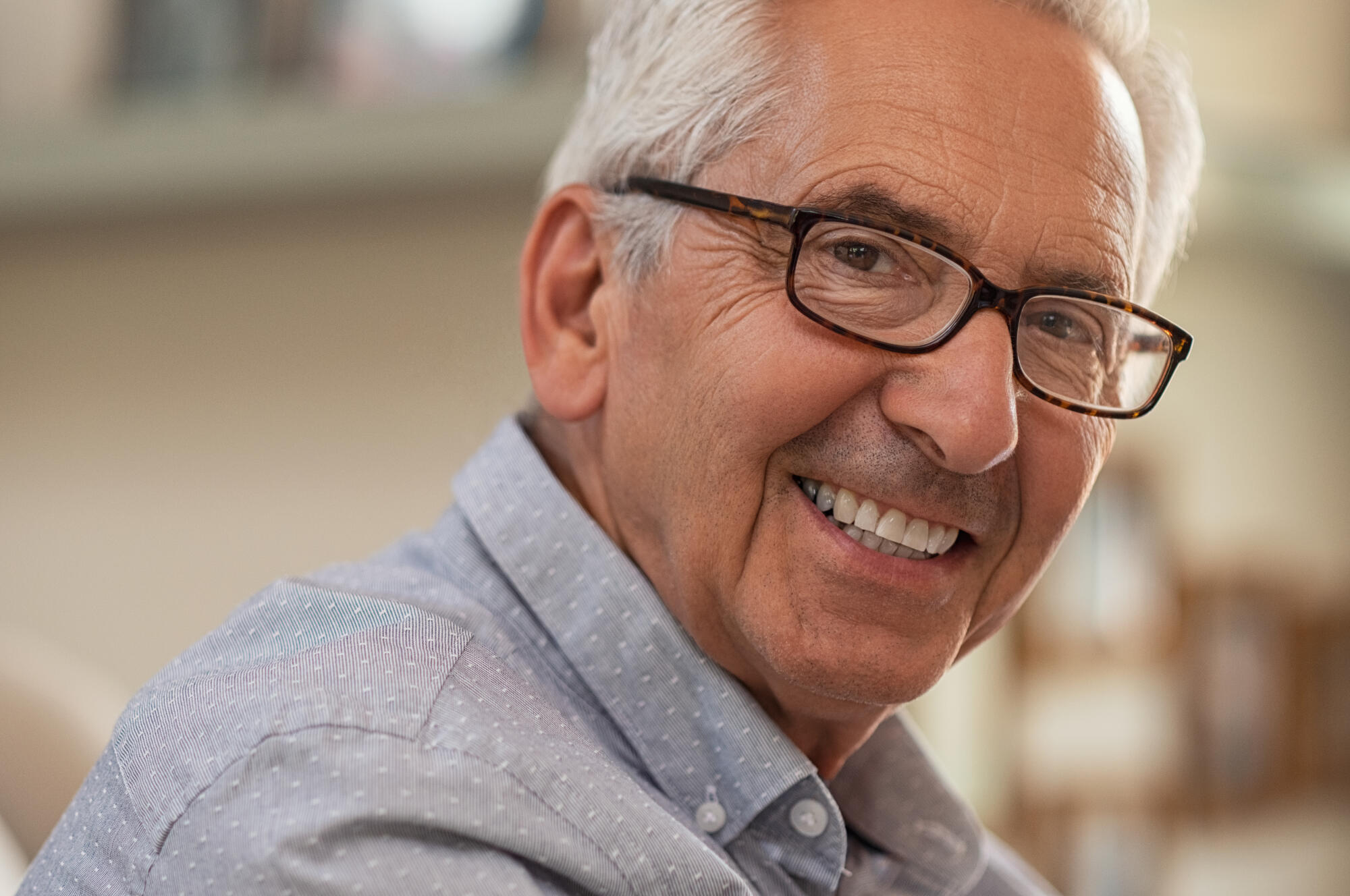 Portrait,Of,Smiling,Senior,Man,With,Eyeglasses,Looking,At,Camera.