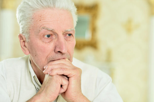 Close up portrait of thoughtful senior man