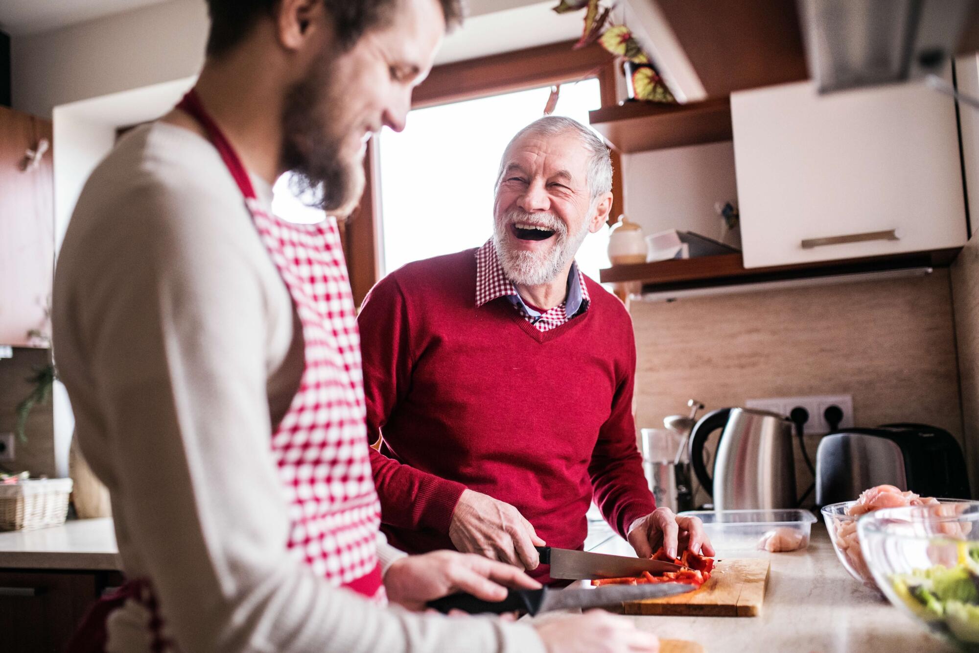 Hipster,Son,With,His,Senior,Father,Cooking,In,The,Kitchen.