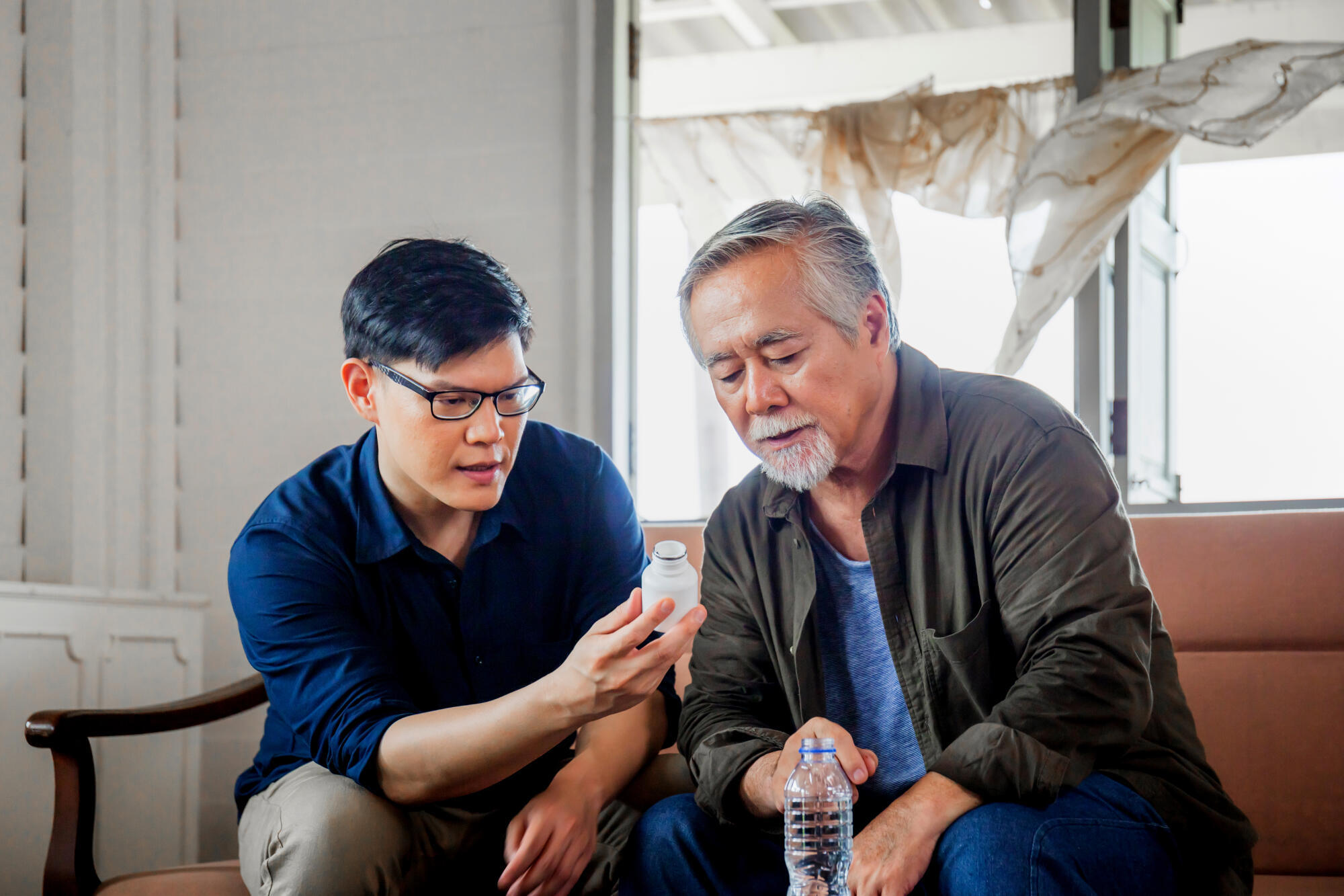 Middle aged son takes care of sick senior father, Happiness Asia Middle aged son takes care of sick senior father, Happiness Asia