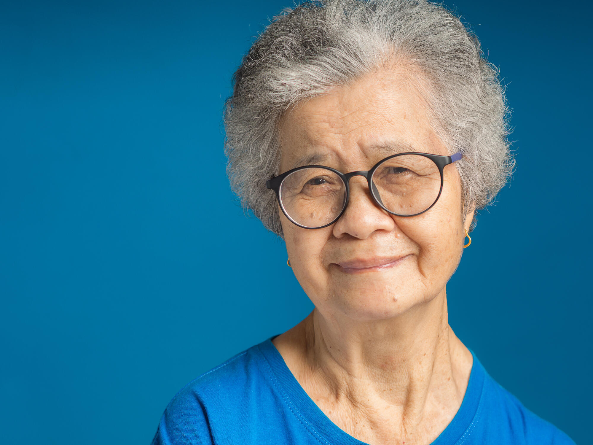 Portrait of a senior woman with short gray hair looking at the c Portrait of a senior woman with short gray hair looking at the c