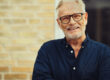 Content,Senior,Man,With,A,Beard,And,Wearing,Glasses,Laughing