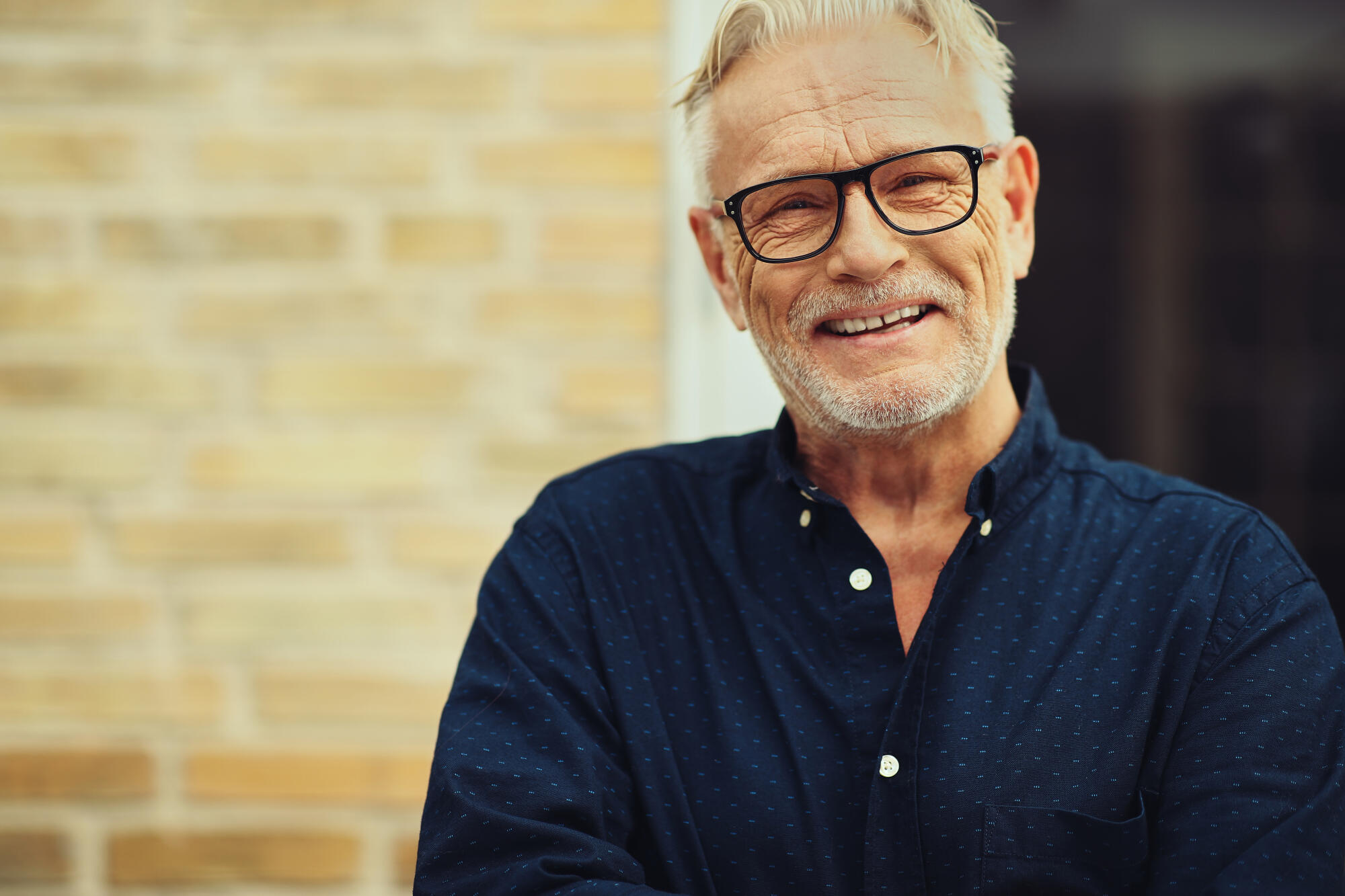 Content,Senior,Man,With,A,Beard,And,Wearing,Glasses,Laughing
