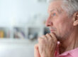 close up portrait of a senior man thinking about something