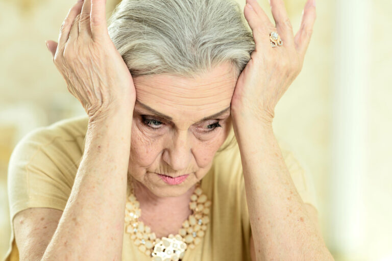 Portrait of a sad elderly woman posing at home Portrait of a sad elderly woman posing at home