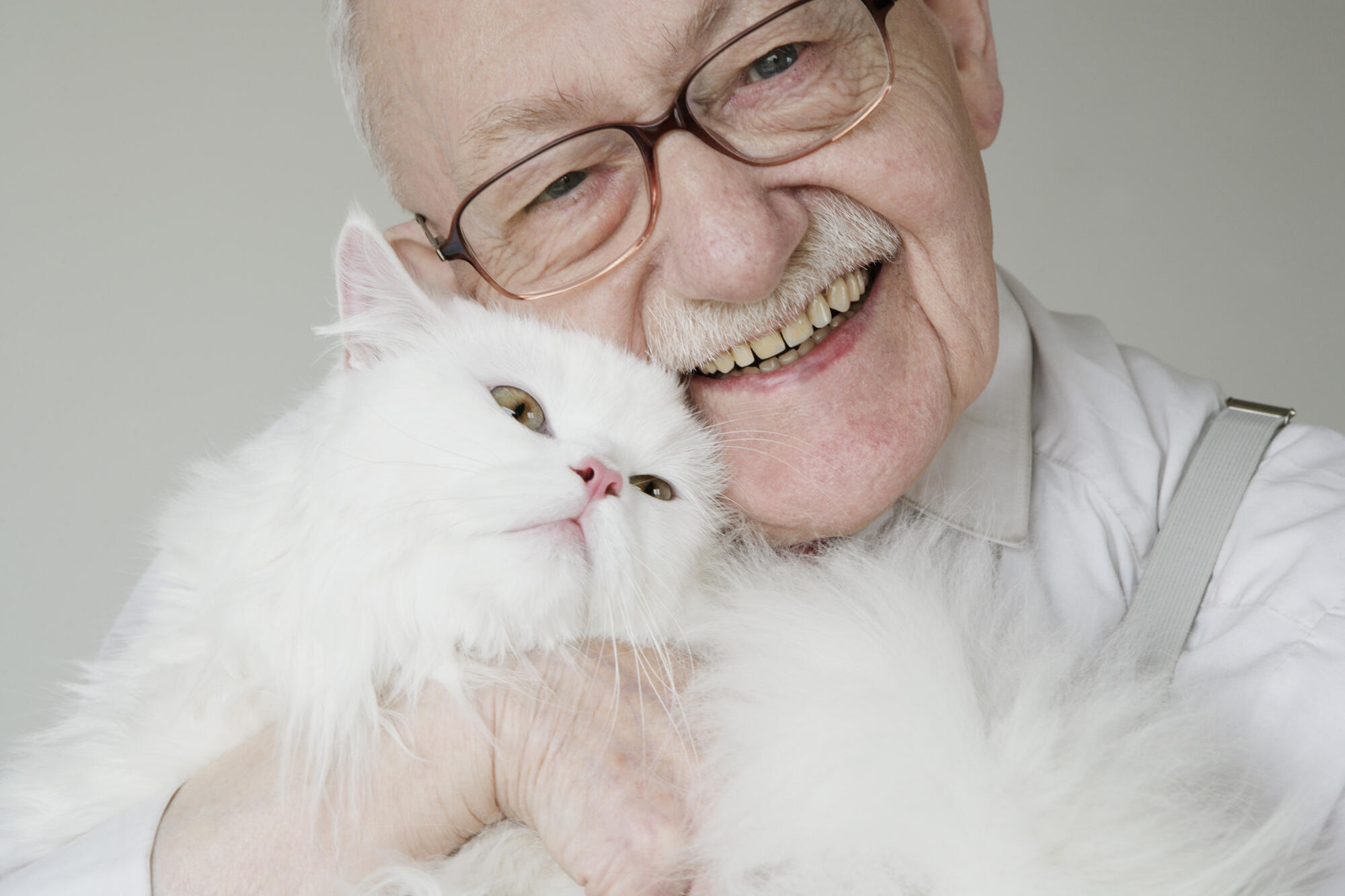 Close,Up,Senior,Man,Hugging,Cat,And,Smiling Close,Up,Senior,Man,Hugging,Cat,And,Smiling