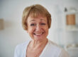 Portrait of senior elderly woman that is at home in the living room