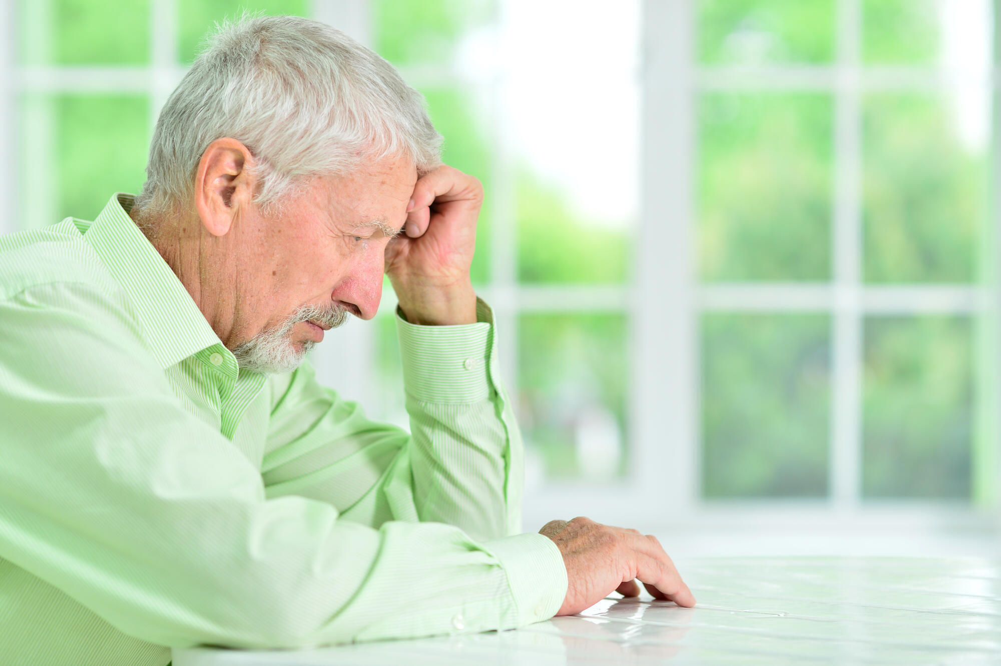 close up portrait of a senior man thinking about something close up portrait of a senior man thinking about something